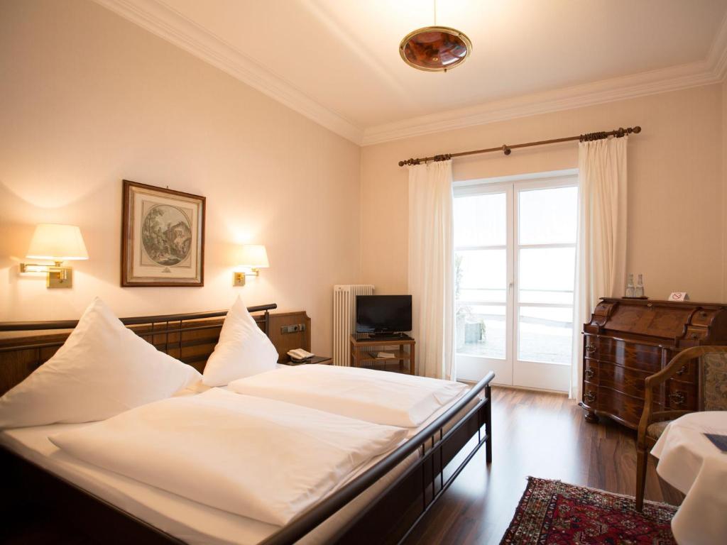 Postel nebo postele na pokoji v ubytování Hotel Müller