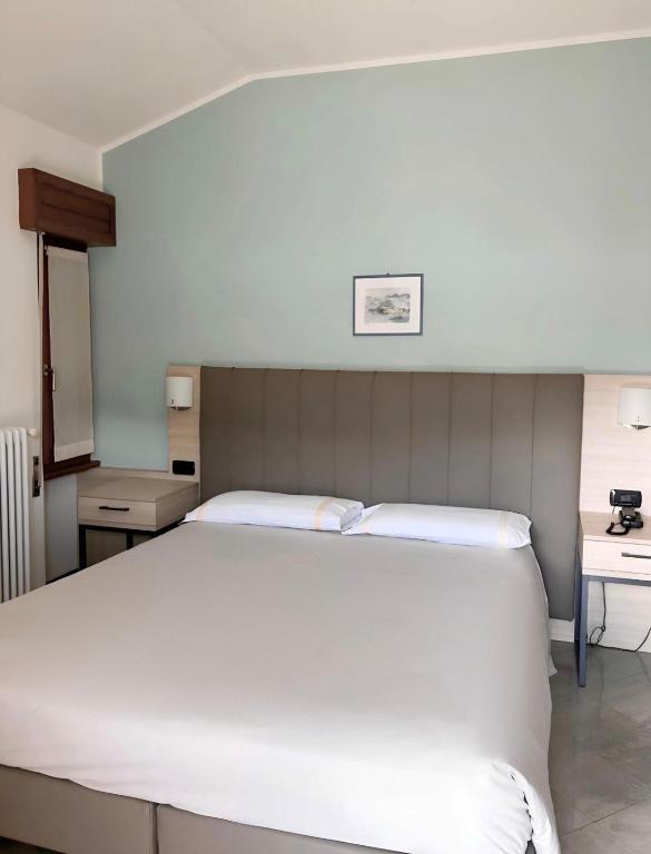 Een bed of bedden in een kamer bij Hotel Sole