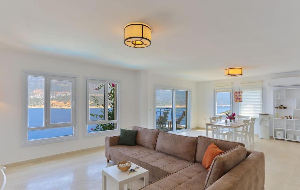a living room with a couch and a table at Stella Sea View & Access to Sea in Kas
