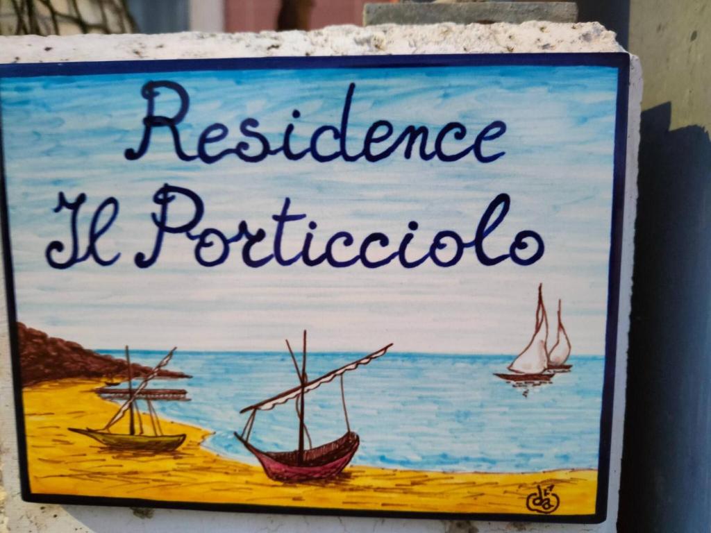 a sign on a wall with boats in the water at Casa al Porticciolo Campomarino Lido vicino Termoli in Campomarino
