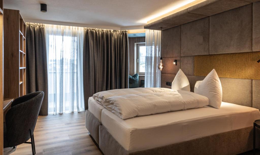 Postel nebo postele na pokoji v ubytování Hotel Lamtana