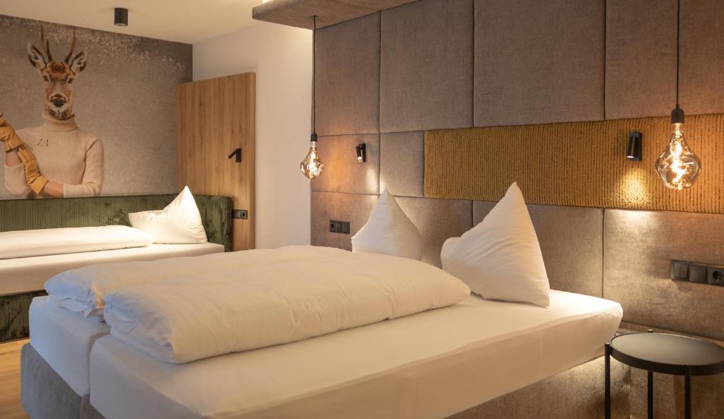 Postel nebo postele na pokoji v ubytování Hotel Lamtana