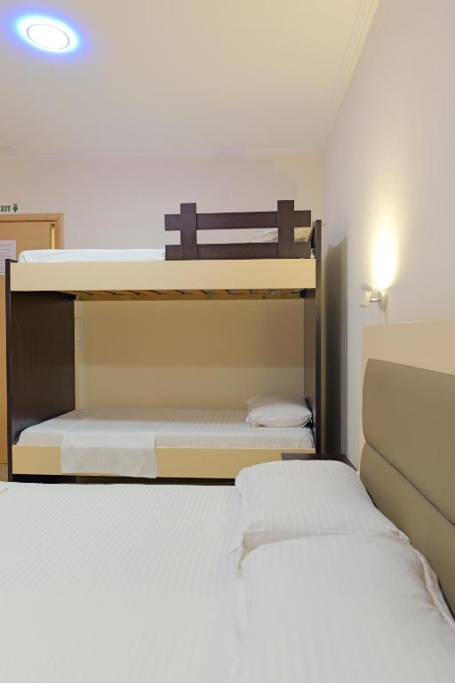 Postel nebo postele na pokoji v ubytování Vila Kristiano Ksamil