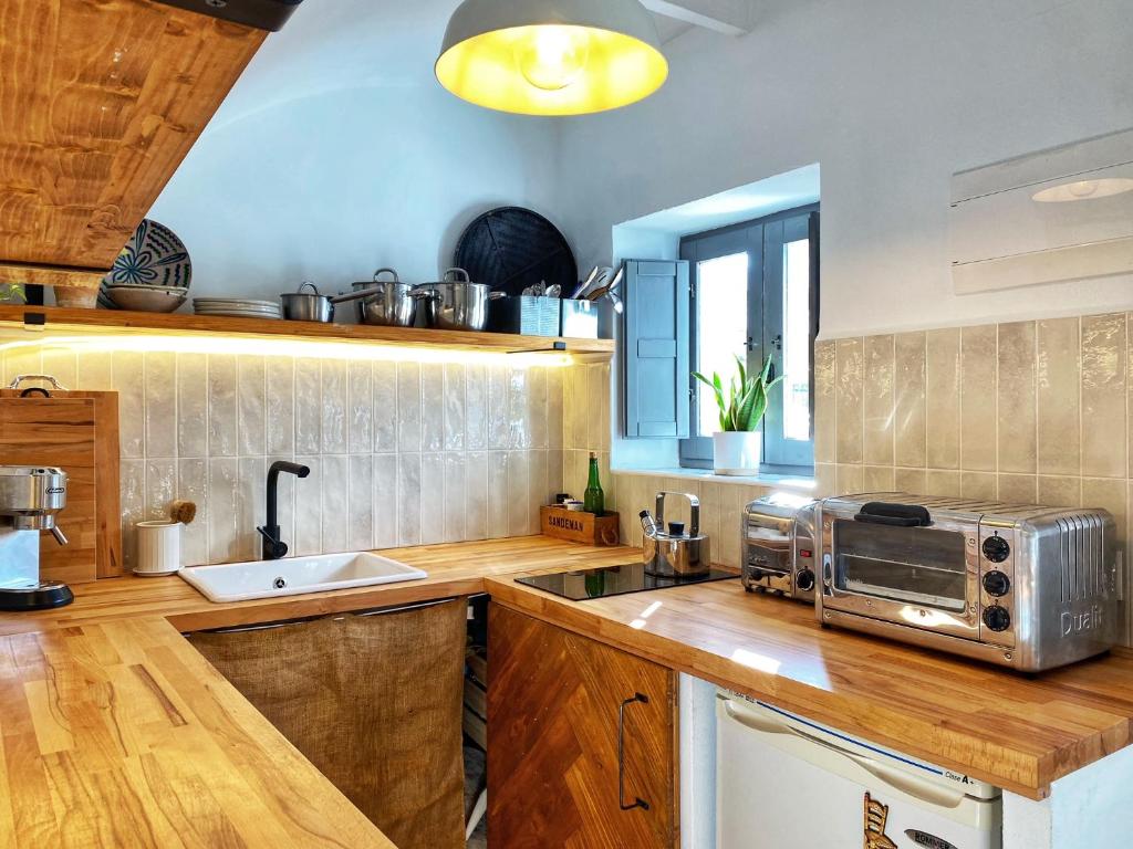 Kuchyň nebo kuchyňský kout v ubytování Castillo Suite 15 Comares