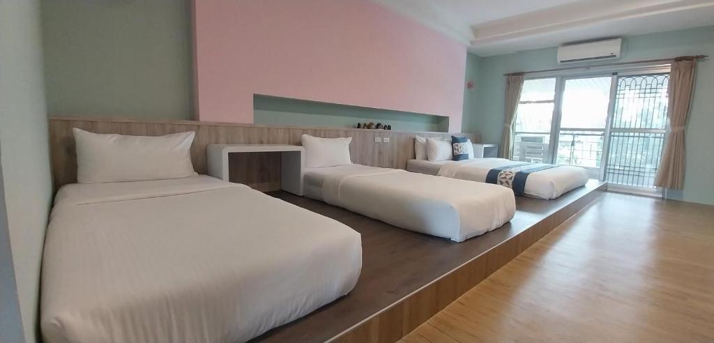 Postel nebo postele na pokoji v ubytování Coconutpalm Home