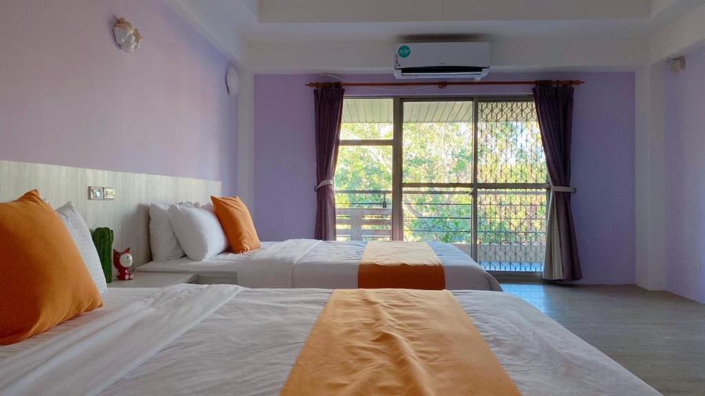 Postel nebo postele na pokoji v ubytování Coconutpalm Home