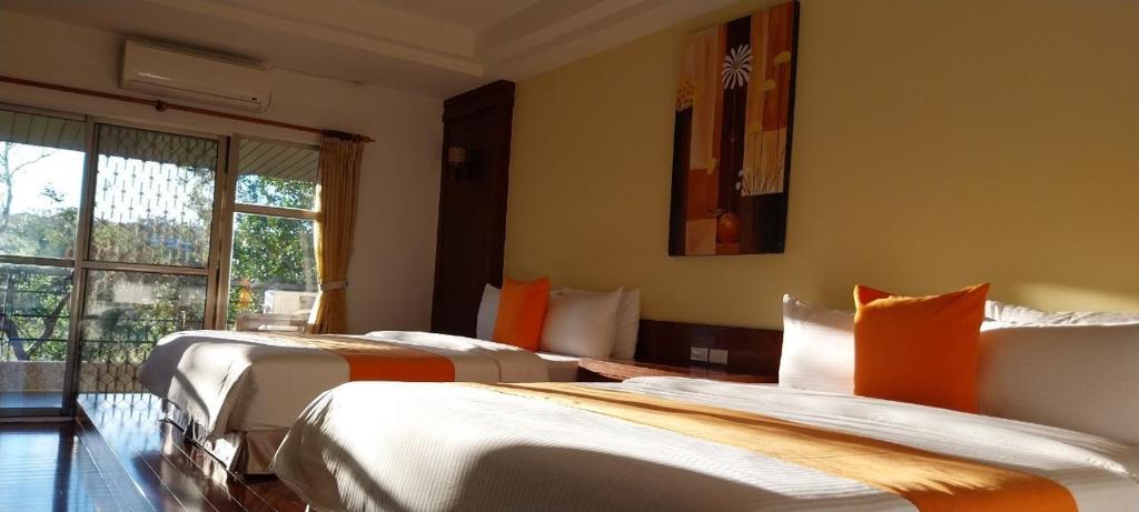 Postel nebo postele na pokoji v ubytování Coconutpalm Home