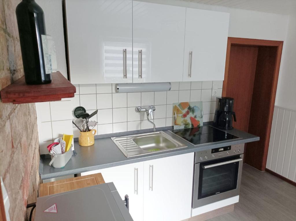 Kuchyň nebo kuchyňský kout v ubytování Poppenga - Feha Wallperle
