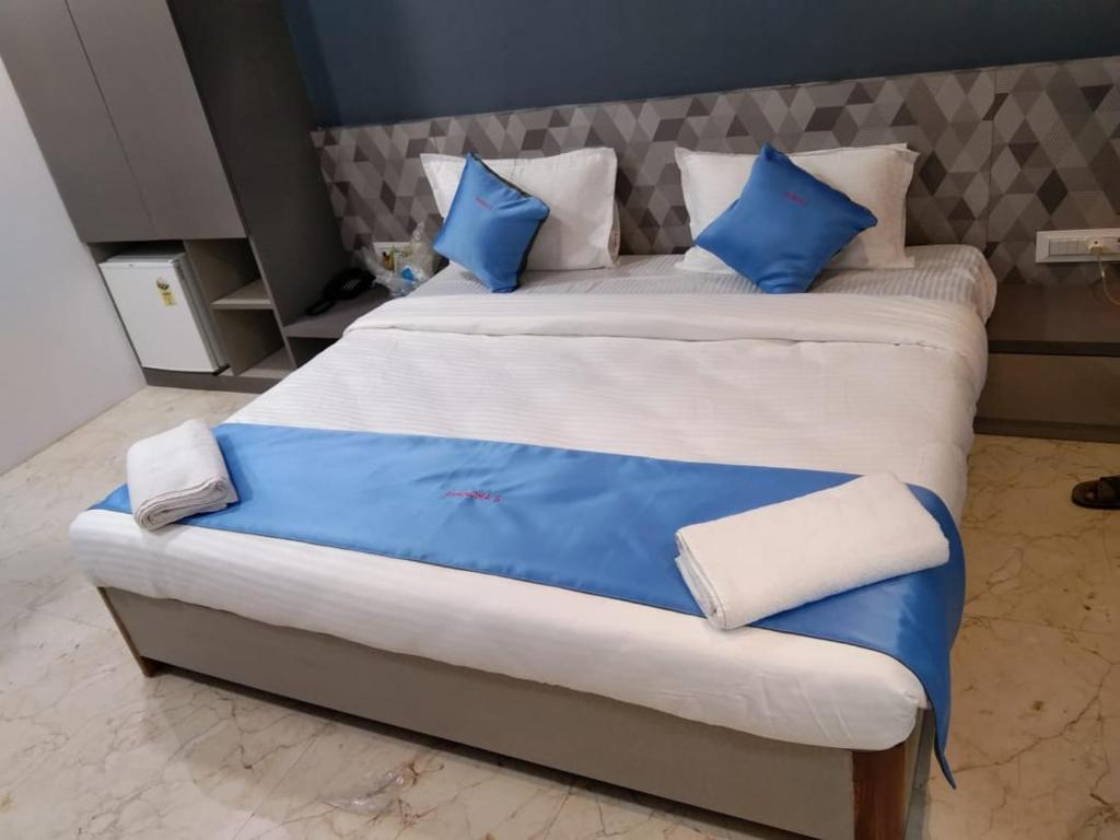 Postel nebo postele na pokoji v ubytování Mandhas club & resort