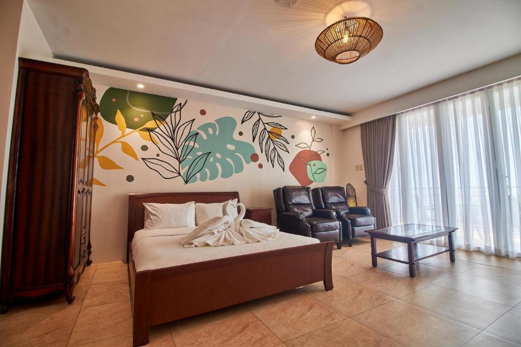 Postel nebo postele na pokoji v ubytování Mactan Resort by 1521