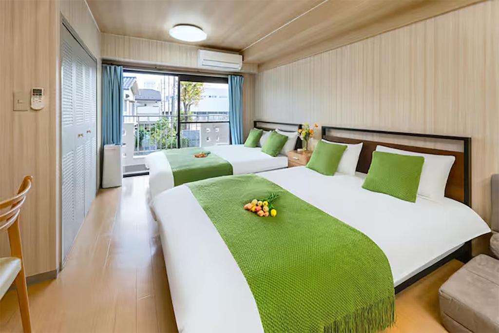 Postel nebo postele na pokoji v ubytování Room 204 Nishi-Shinjuku Gochome 9 minutes walk 40 square meters Sleeps up to 6 people