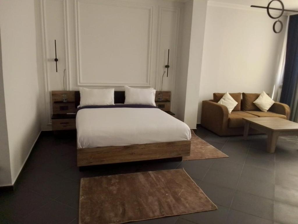 Postel nebo postele na pokoji v ubytování The Hotel Syracuse