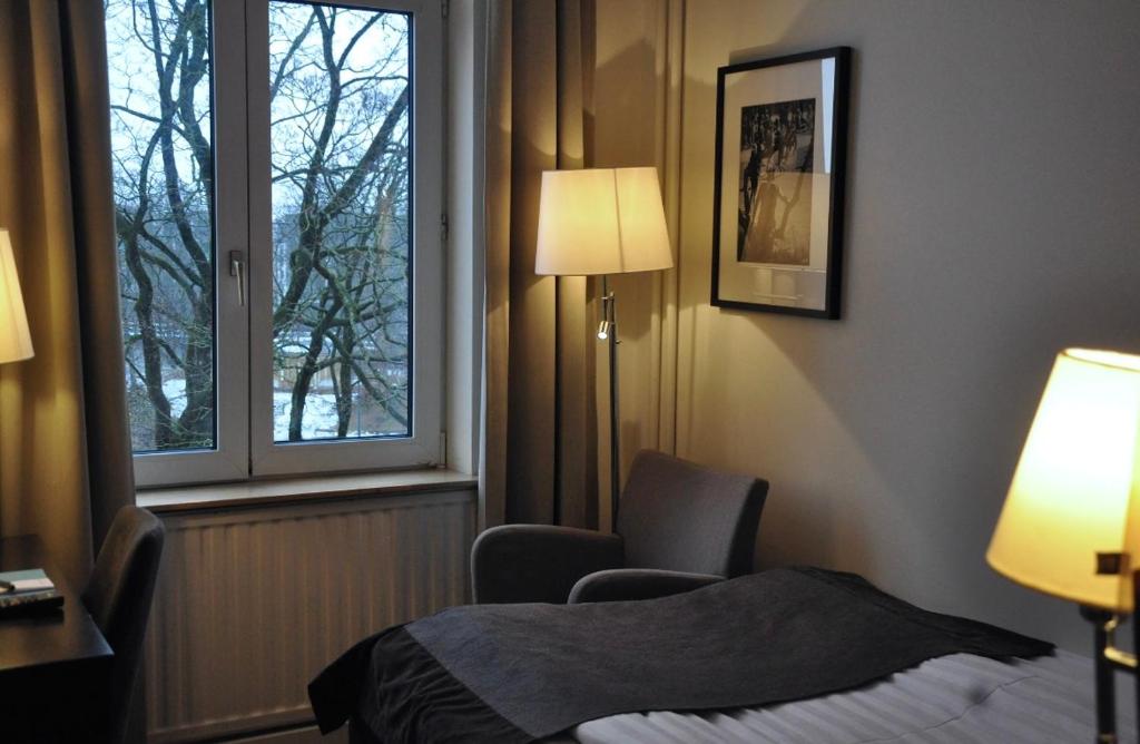 Postel nebo postele na pokoji v ubytování Home Hotel Norre Park