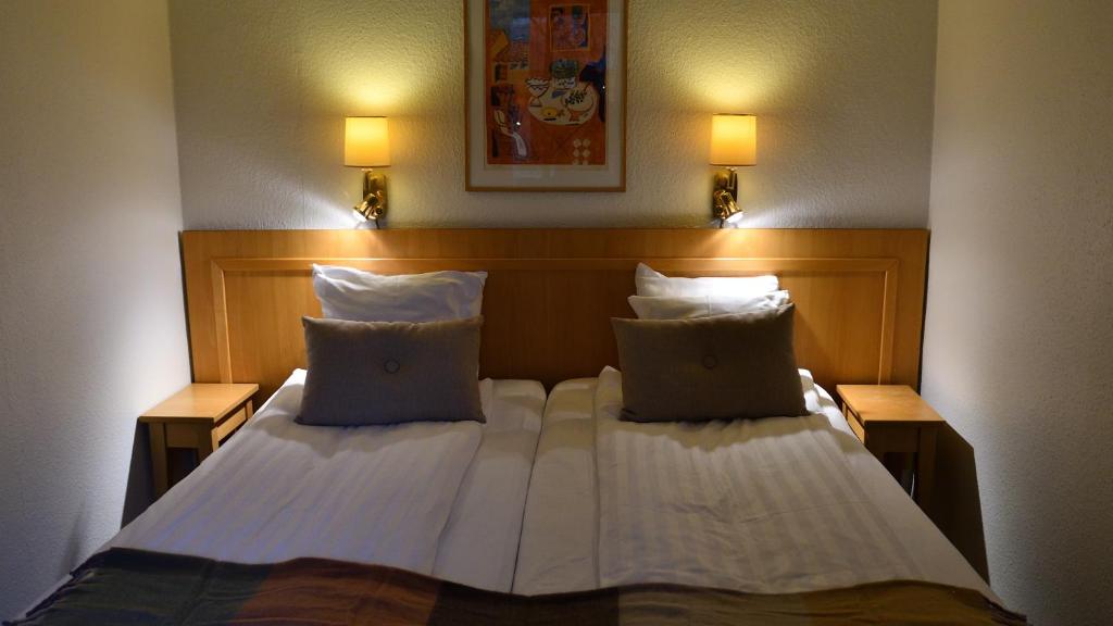 Postel nebo postele na pokoji v ubytování Home Hotel Norre Park