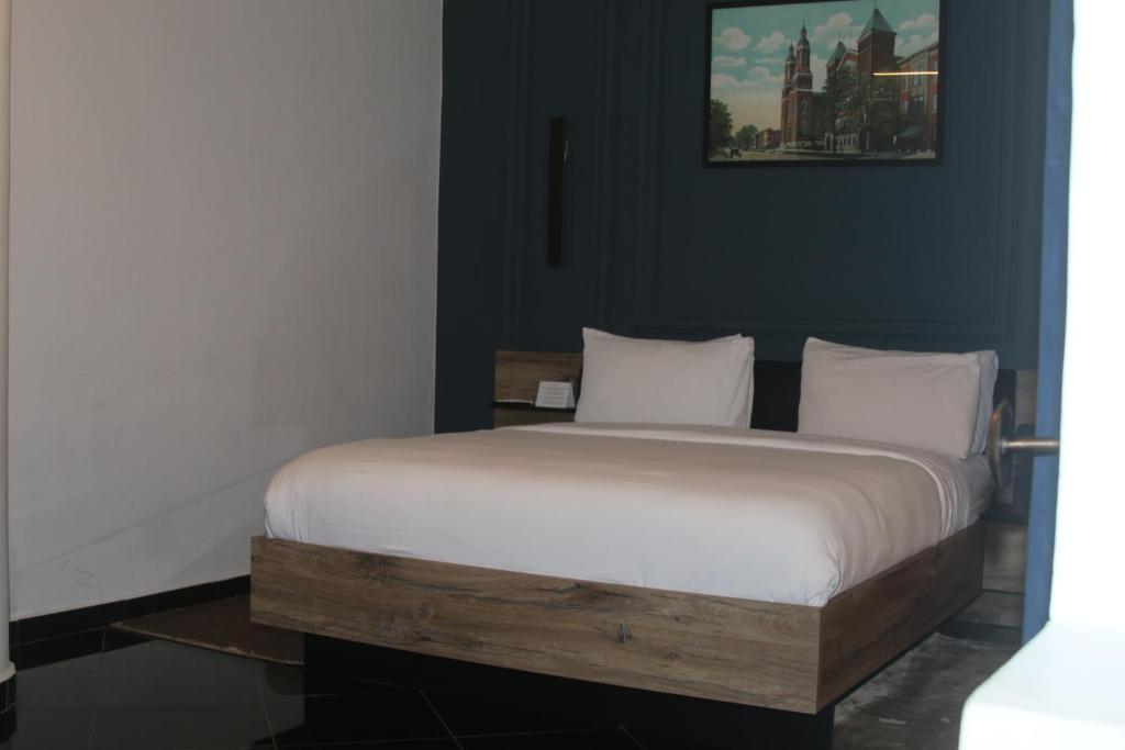 Postel nebo postele na pokoji v ubytování The Hotel Syracuse