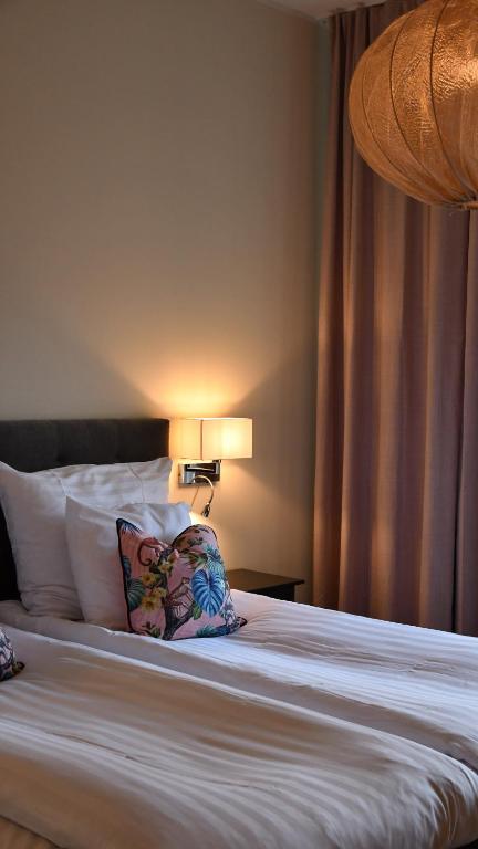 Postel nebo postele na pokoji v ubytování Home Hotel Norre Park
