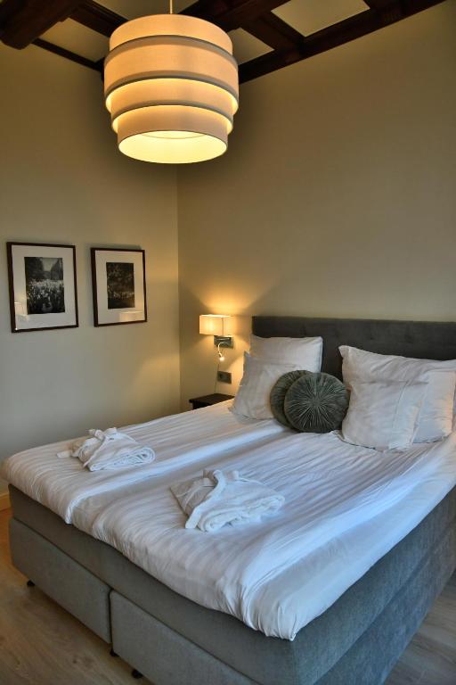 Postel nebo postele na pokoji v ubytování Home Hotel Norre Park
