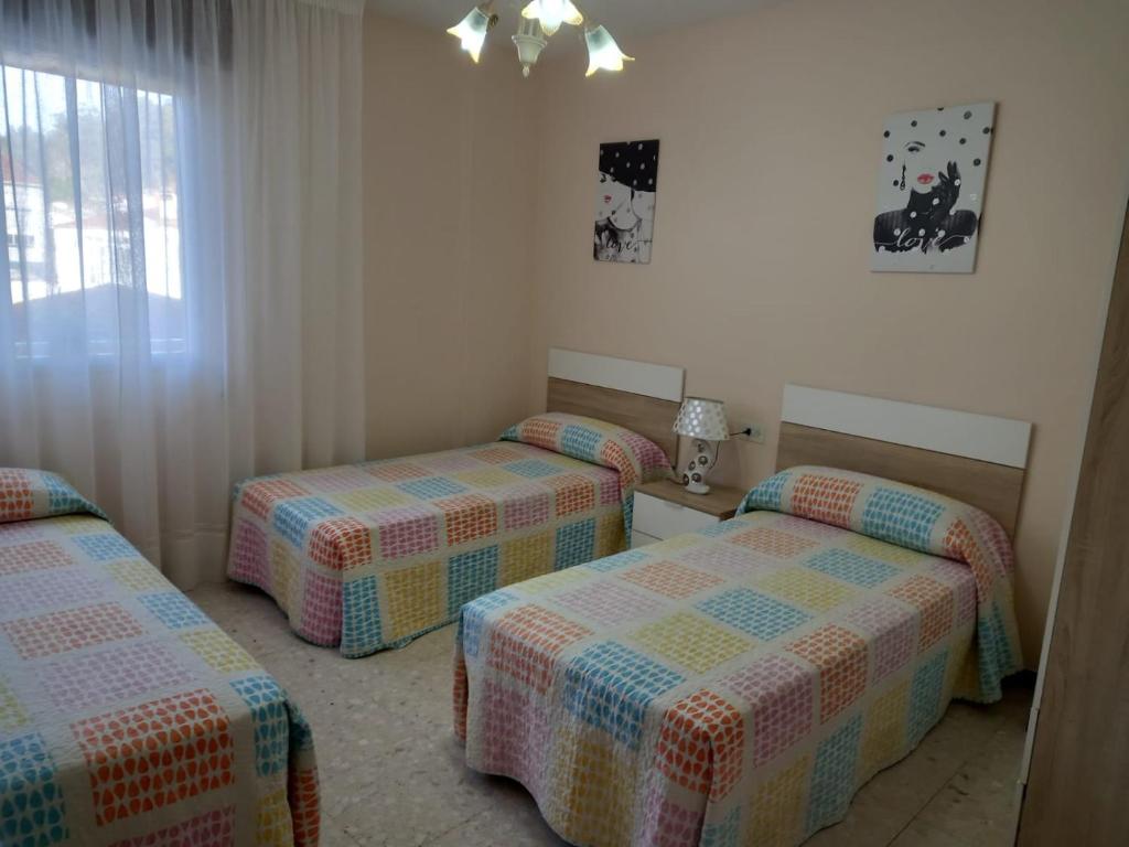 Posteľ alebo postele v izbe v ubytovaní Albergue Agarimo