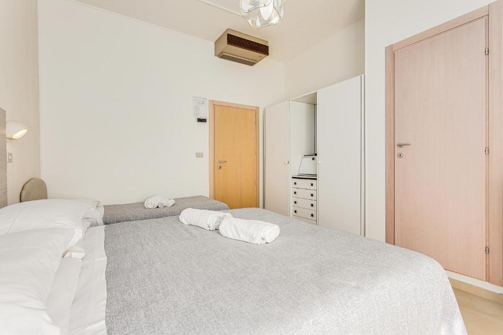 Postel nebo postele na pokoji v ubytování Hotel Caesar