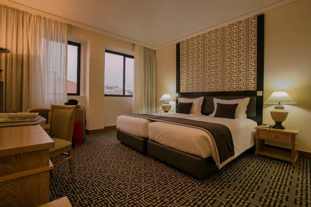 Ein Bett oder Betten in einem Zimmer der Unterkunft Hotel Mundial