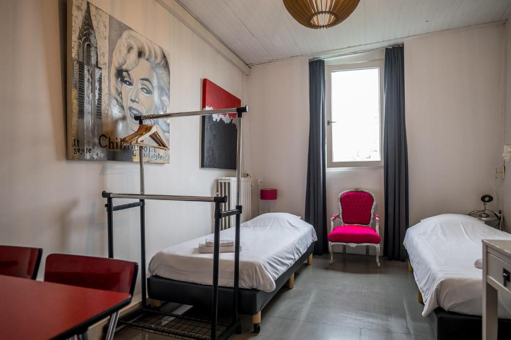 Llit o llits en una habitació de Hotel Urban Dreams