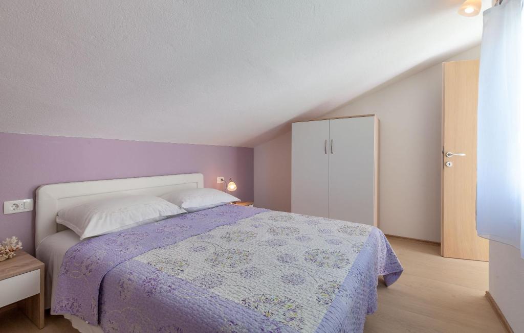 Postel nebo postele na pokoji v ubytování Apartments Kike
