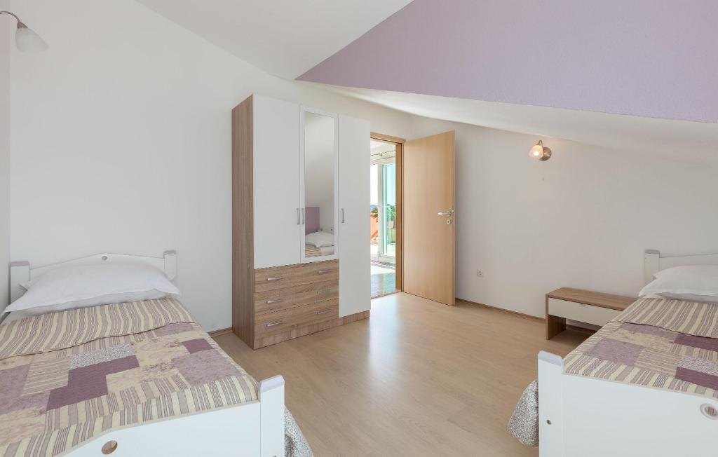 Postel nebo postele na pokoji v ubytování Apartments Kike