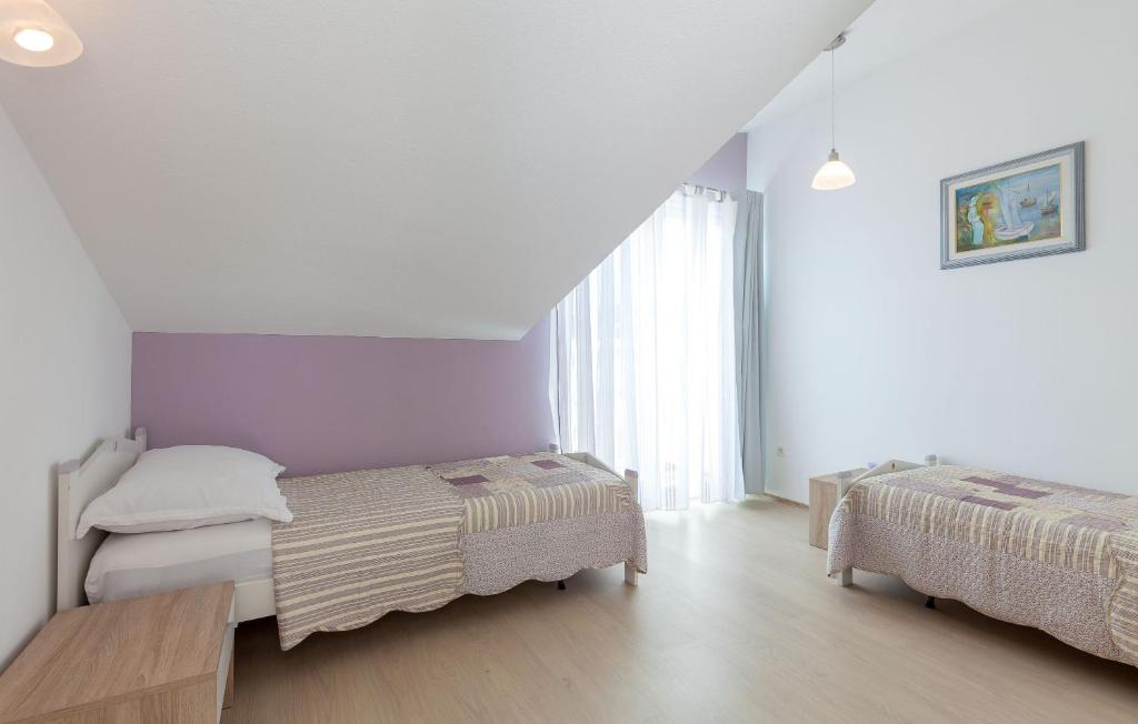 Postel nebo postele na pokoji v ubytování Apartments Kike