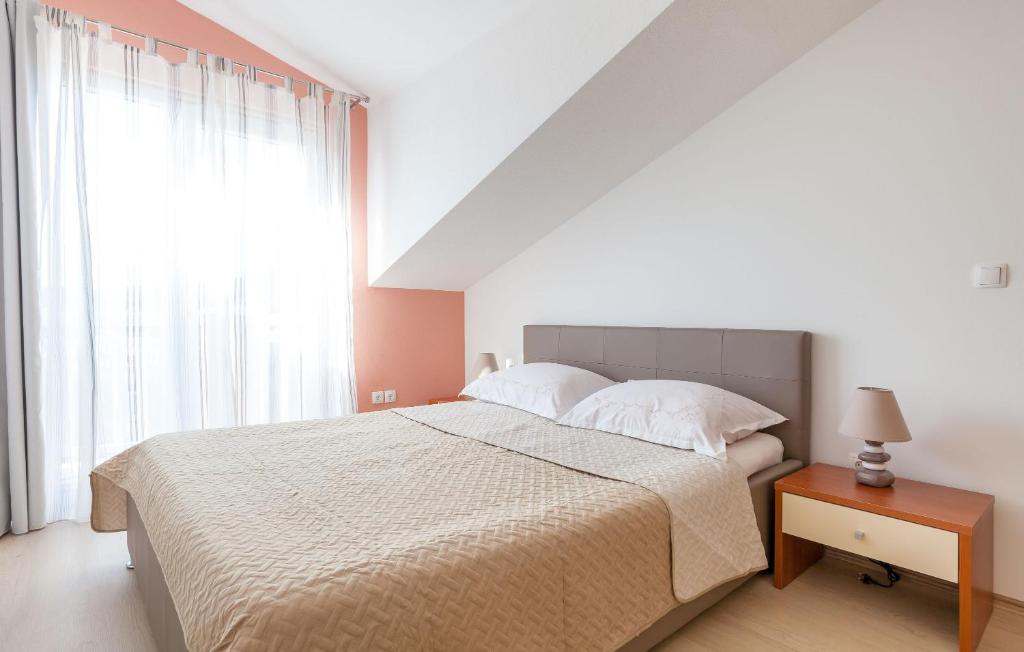 Postel nebo postele na pokoji v ubytování Apartments Kike