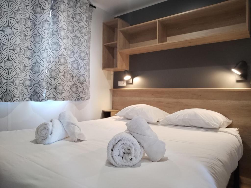 Posteľ alebo postele v izbe v ubytovaní Camping les lodges du lagon