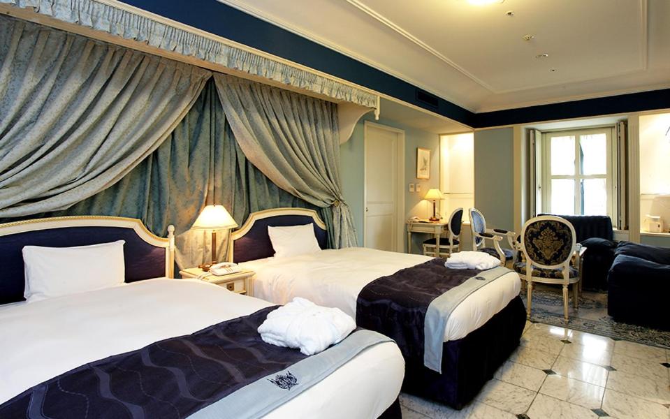 Postel nebo postele na pokoji v ubytování Hotel Monterey Osaka