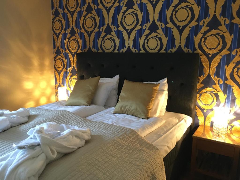 Postel nebo postele na pokoji v ubytování Hotel Wictoria
