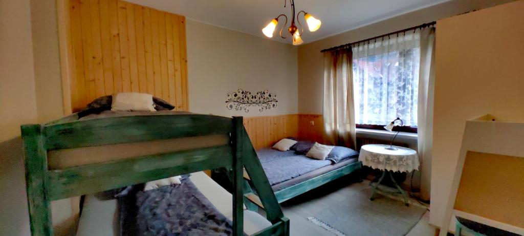 Posteľ alebo postele v izbe v ubytovaní pod Klimczokiem