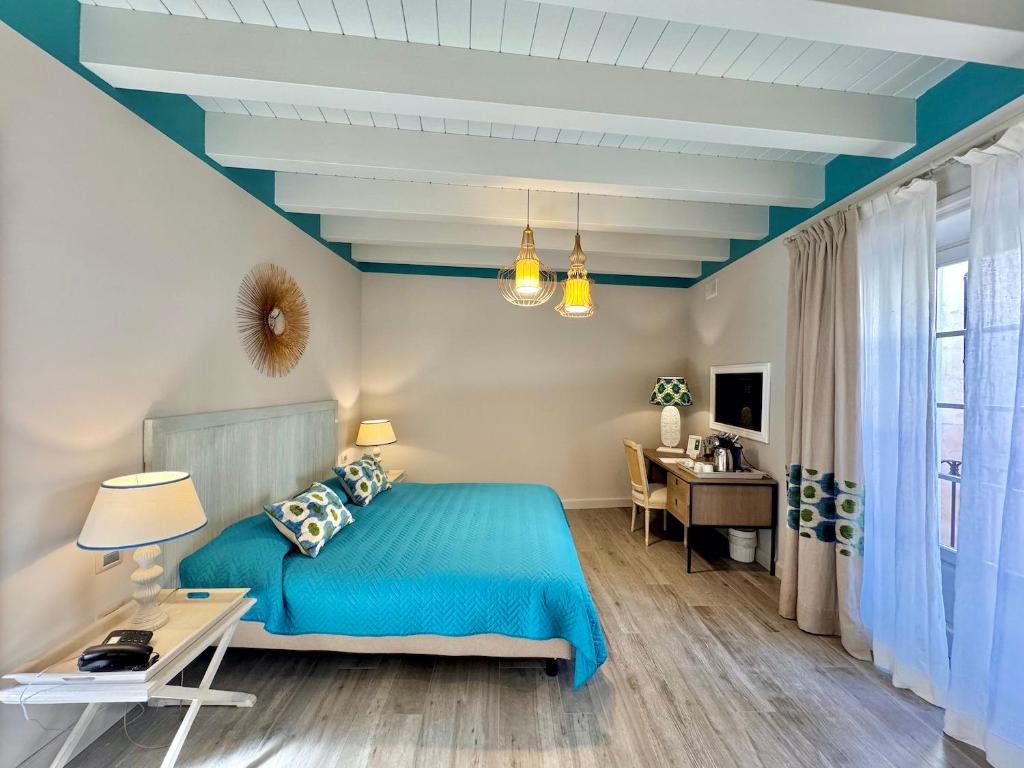 Televízia a/alebo spoločenská miestnosť v ubytovaní Hotel San Michele