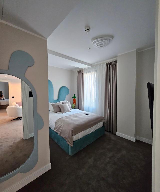 Postel nebo postele na pokoji v ubytování New Belgrade Premium Hotel