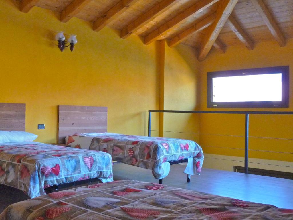 Postel nebo postele na pokoji v ubytování Tra Lago e Montagna Baita la Morena