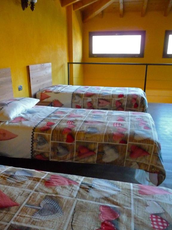 Postel nebo postele na pokoji v ubytování Tra Lago e Montagna Baita la Morena