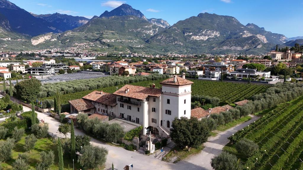 a village with mountains in the background at Residence La Colombera in Riva del Garda