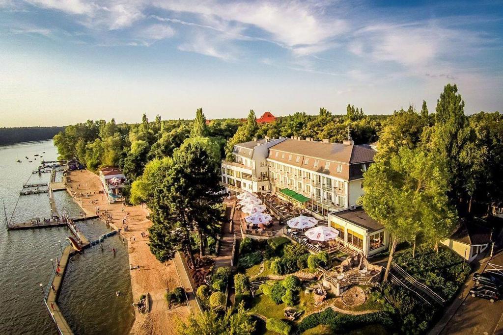 an aerial view of a resort on the water at Hotel Pietrak in Wągrowiec