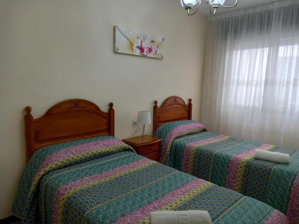 Posteľ alebo postele v izbe v ubytovaní Albergue Agarimo