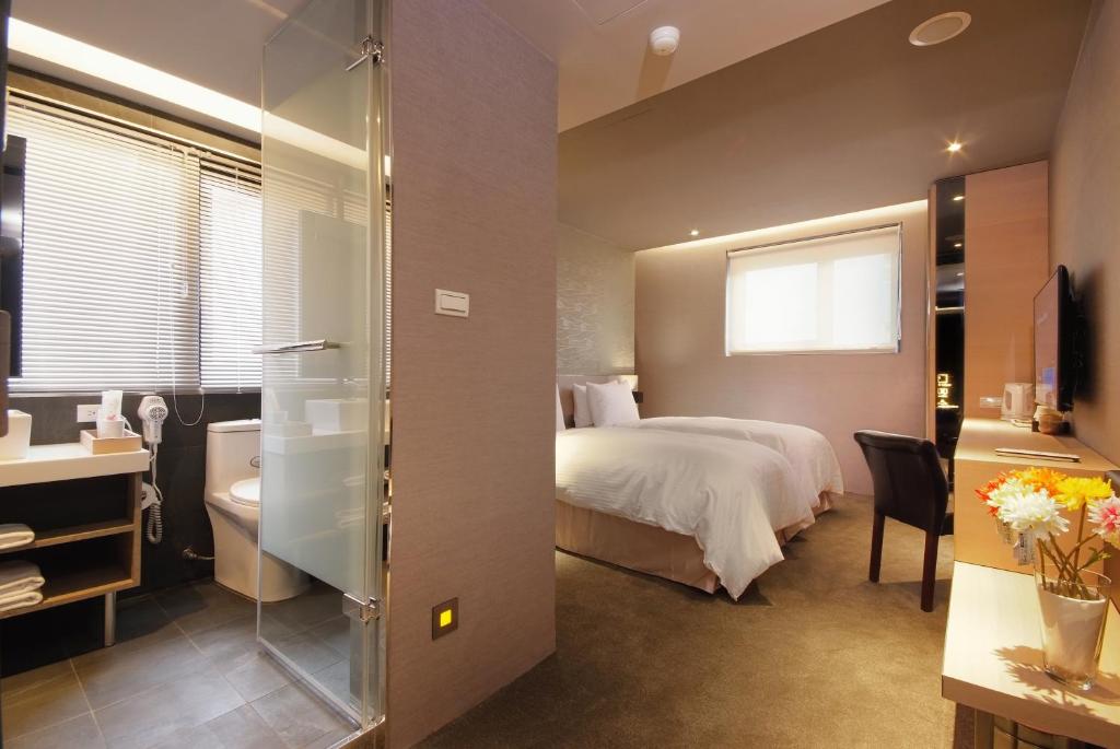Postel nebo postele na pokoji v ubytování Guest Hotel