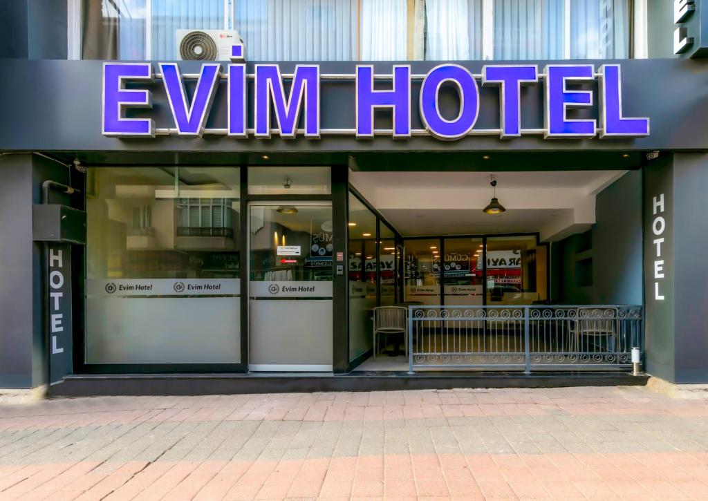 a store front of a gym hotel with a purple sign at EViM HOTEL ÇORLU in Çorlu
