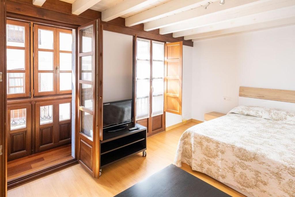 A bed or beds in a room at El Peregrino Llanes VUT