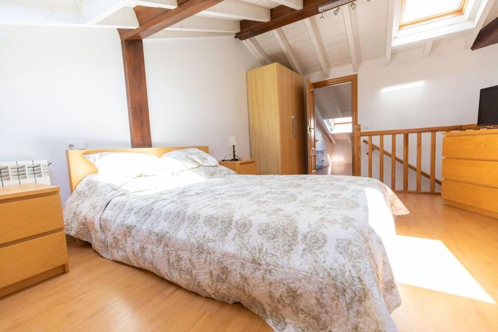 A bed or beds in a room at El Peregrino Llanes VUT