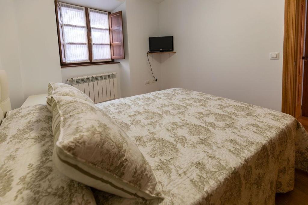 A bed or beds in a room at El Peregrino Llanes VUT