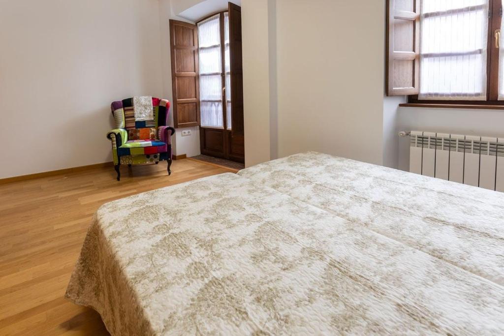 A bed or beds in a room at El Peregrino Llanes VUT