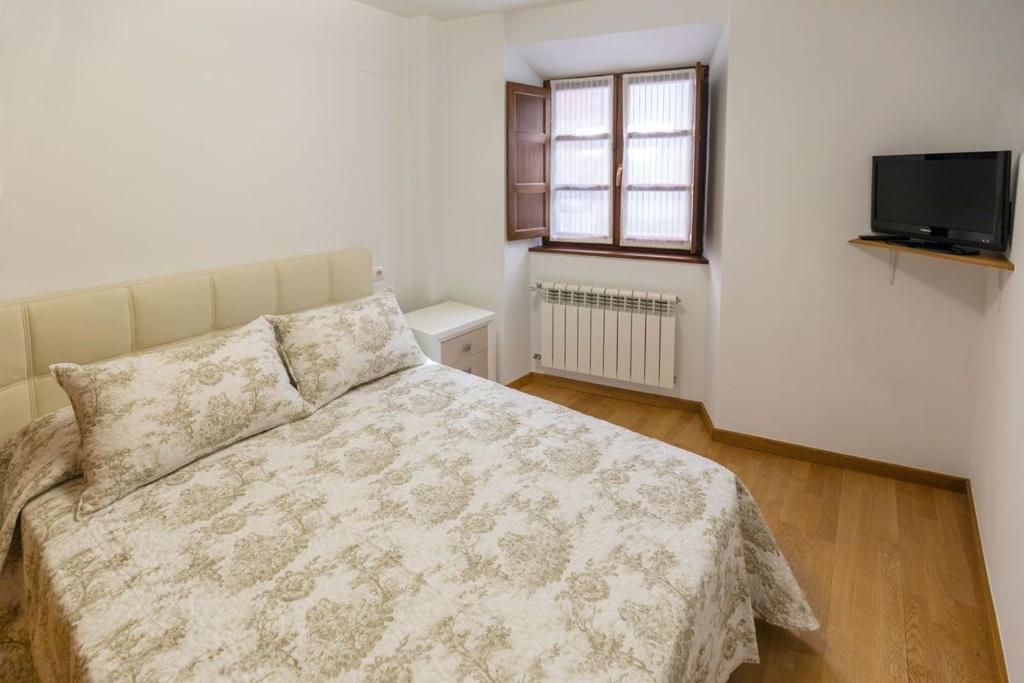 A bed or beds in a room at El Peregrino Llanes VUT
