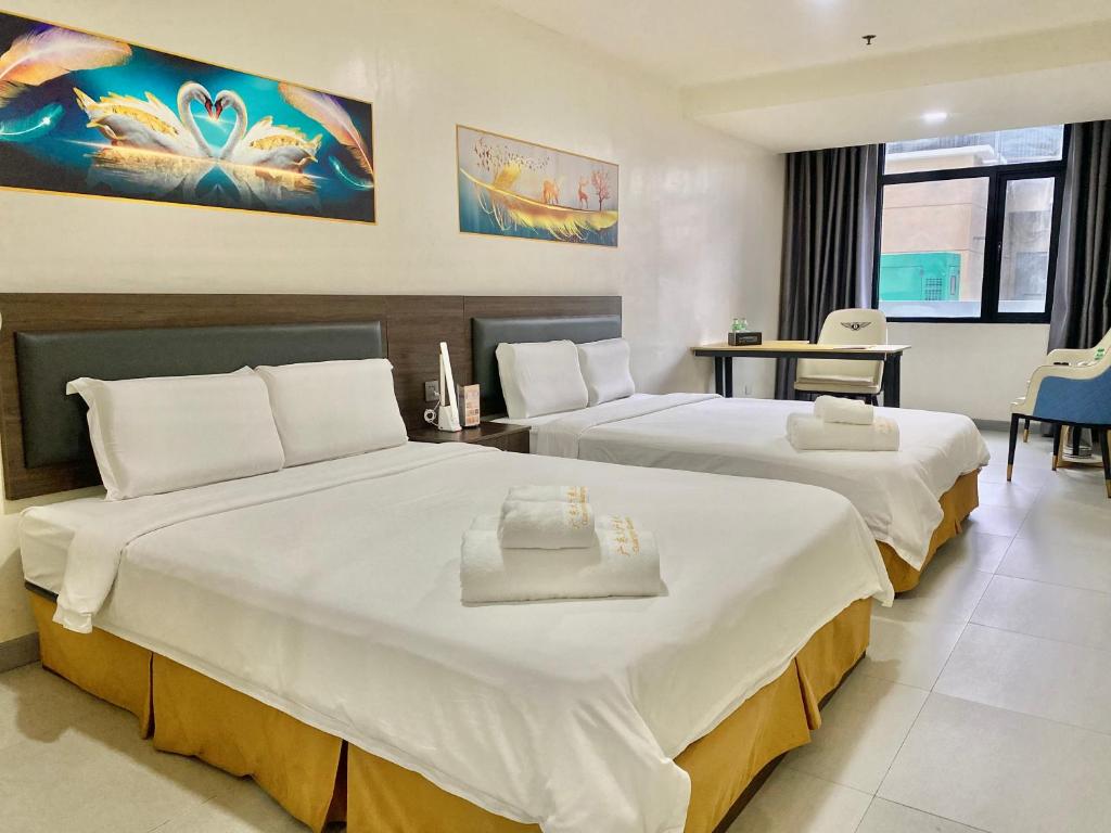 Postel nebo postele na pokoji v ubytování 广东大酒店Guangdon Business Hotel-SM Mall of Asia, SMX & Manila World Trade Center