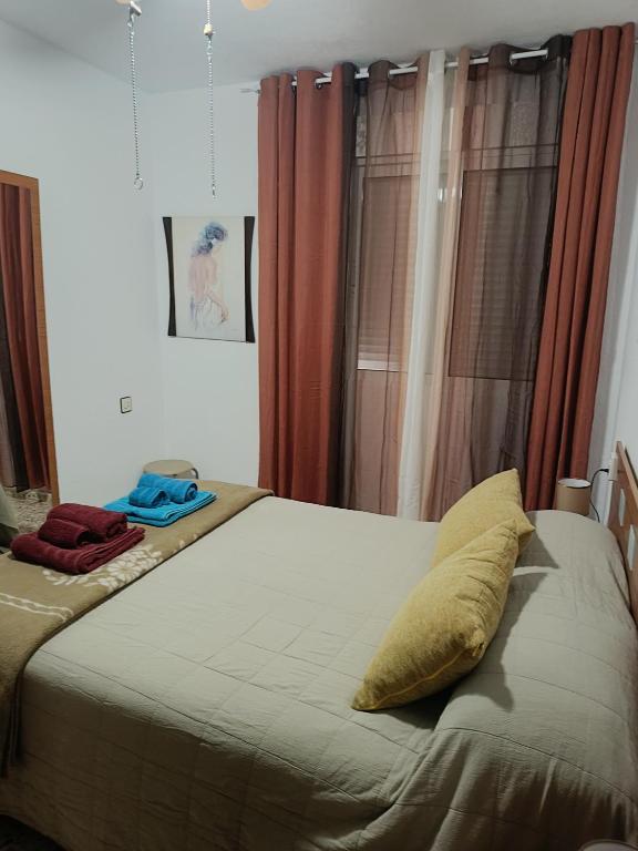 Postel nebo postele na pokoji v ubytování Casa EL CASTILLO ,a 5 kilómetros de la playa