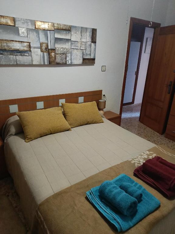 Postel nebo postele na pokoji v ubytování Casa EL CASTILLO ,a 5 kilómetros de la playa